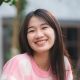 young-happy-woman-person-smiling-with-pink-flower-blooming-pretty-cute-girl-portrait-e1684486401410